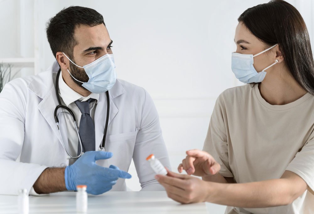 Ethiopian patient and companion meeting a doctor at an Indian hospital to plan treatment