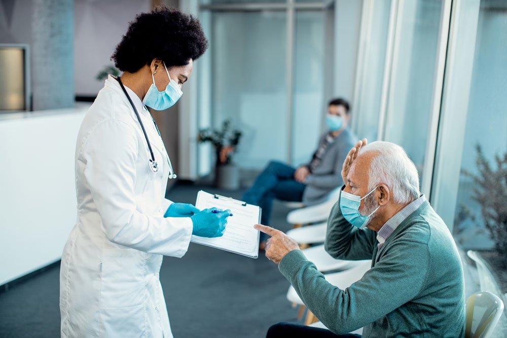 Iraqi patient and companion meeting a doctor at an Indian hospital to plan treatment