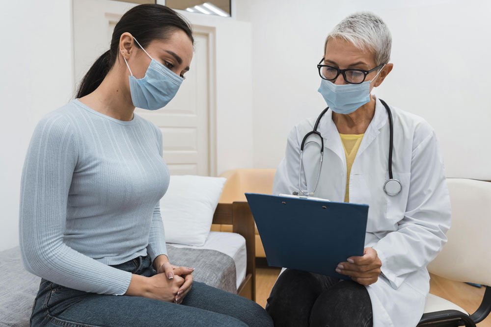 International patient discussing medical treatment in India with a doctor at an Indian hospital